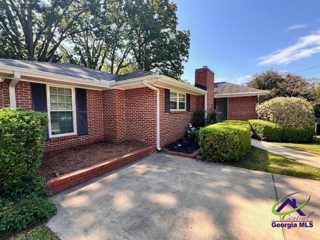234 Briarcliff Rd, Warner Robins, GA 31088 - view of side of property featuring brick siding and a chimney