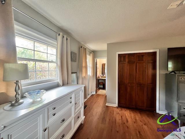 234 Briarcliff Rd, Warner Robins, GA 31088 - bedroom featuring a textured ceiling, wood finished floors, and a closet