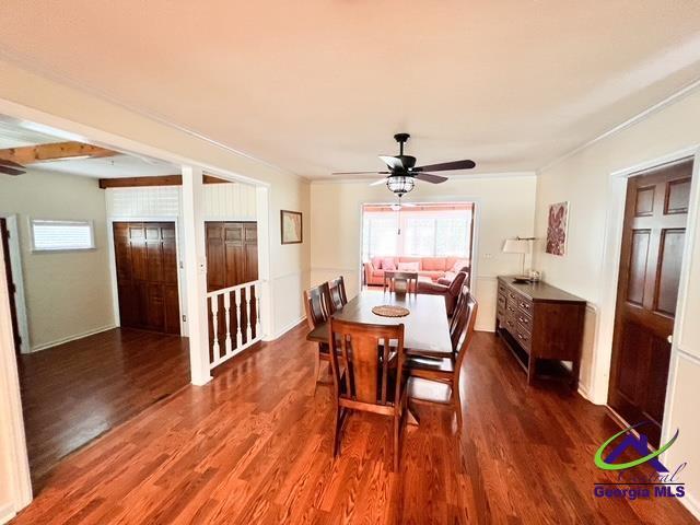 234 Briarcliff Rd, Warner Robins, GA 31088 - dining space featuring dark wood finished floors, healthy amount of natural light, a ceiling fan, and ornamental molding