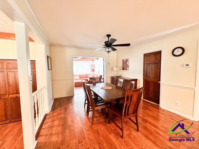 234 Briarcliff Rd, Warner Robins, GA 31088 - dining area with crown molding, light wood-style flooring, and ceiling fan