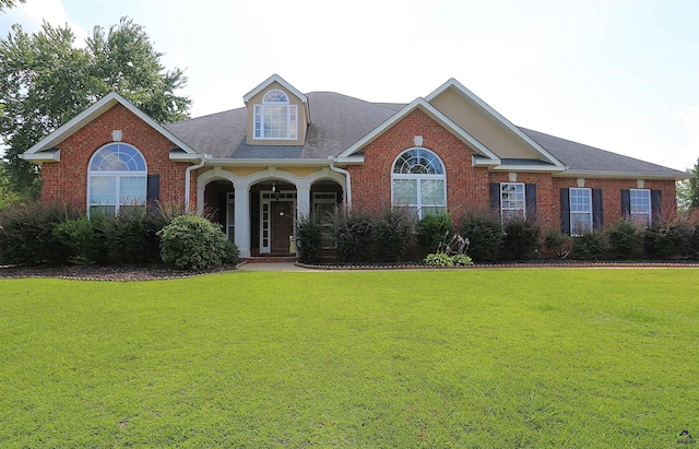 217 Wilsons Creek Bnd, Bonaire, GA 31005 - view of front facade with a front lawn, brick siding, and roof with shingles