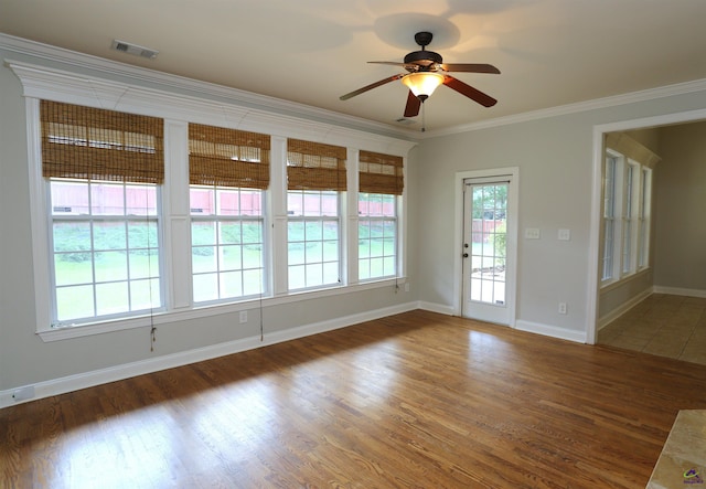217 Wilsons Creek Bnd, Bonaire, GA 31005 - spare room with crown molding, wood finished floors, and a ceiling fan