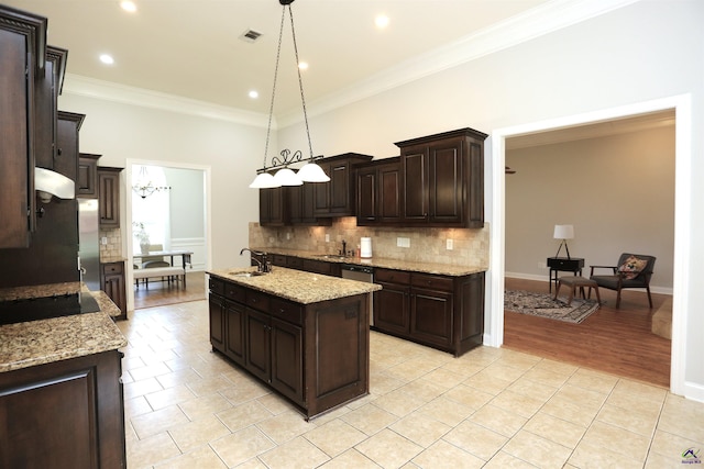 217 Wilsons Creek Bnd, Bonaire, GA 31005 - kitchen featuring backsplash, ornamental molding, dark brown cabinetry, a kitchen island with sink, and light tile patterned floors