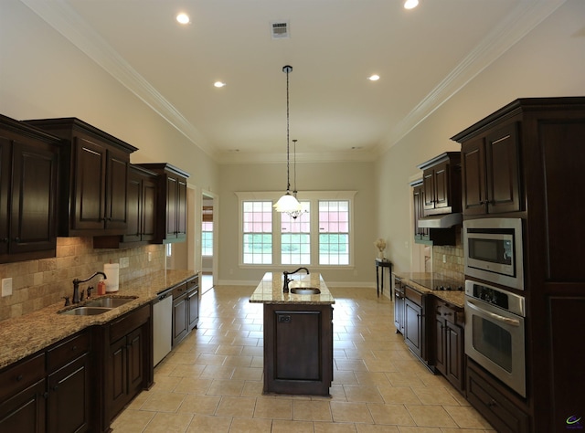 217 Wilsons Creek Bnd, Bonaire, GA 31005 - kitchen featuring stainless steel appliances, an island with sink, backsplash, recessed lighting, and light stone countertops