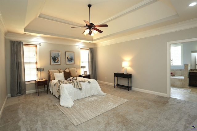 217 Wilsons Creek Bnd, Bonaire, GA 31005 - carpeted bedroom featuring a raised ceiling, crown molding, connected bathroom, and a ceiling fan