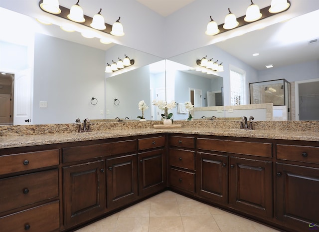 217 Wilsons Creek Bnd, Bonaire, GA 31005 - bathroom featuring tile patterned flooring, double vanity, and a stall shower
