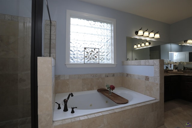 217 Wilsons Creek Bnd, Bonaire, GA 31005 - bathroom with vanity, a jetted tub, tiled shower, and tile patterned flooring