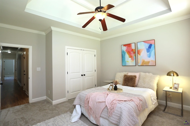 217 Wilsons Creek Bnd, Bonaire, GA 31005 - bedroom with a raised ceiling, carpet floors, a closet, crown molding, and a ceiling fan