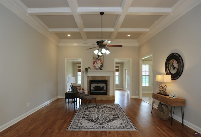 217 Wilsons Creek Bnd, Bonaire, GA 31005 - living room featuring a ceiling fan, dark wood-type flooring, beam ceiling, a tile fireplace, and coffered ceiling