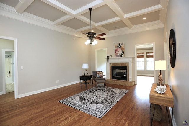 217 Wilsons Creek Bnd, Bonaire, GA 31005 - living room with a tiled fireplace, coffered ceiling, beamed ceiling, wood finished floors, and a ceiling fan