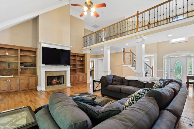 513 Litchfield, Macon, GA 31220 - living room with decorative columns, a towering ceiling, ceiling fan, ornamental molding, and wood finished floors