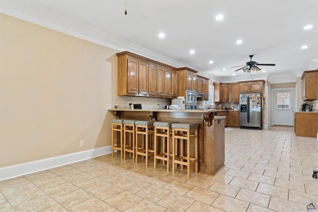 513 Litchfield, Macon, GA 31220 - kitchen with stainless steel fridge with ice dispenser, crown molding, a ceiling fan, a peninsula, and recessed lighting
