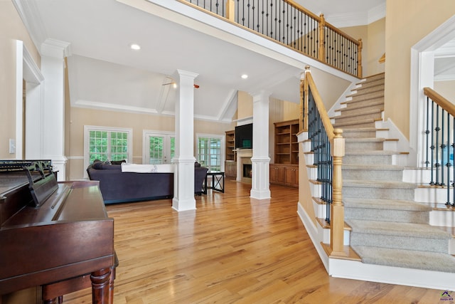 513 Litchfield, Macon, GA 31220 - stairs with decorative columns, wood finished floors, crown molding, a towering ceiling, and recessed lighting