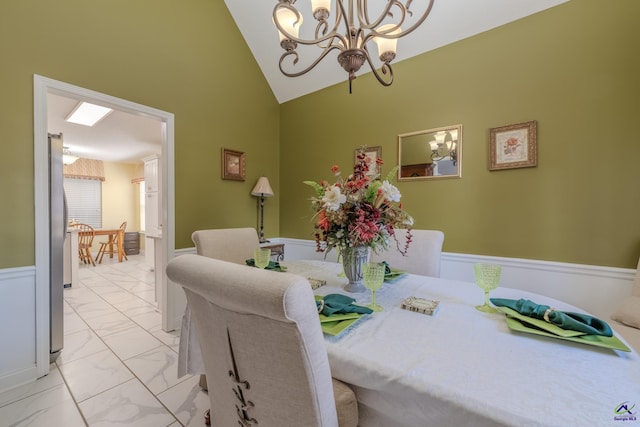118 Quinelle Dr, Perry, GA 31069 - dining space with light marble finish flooring, a chandelier, and high vaulted ceiling