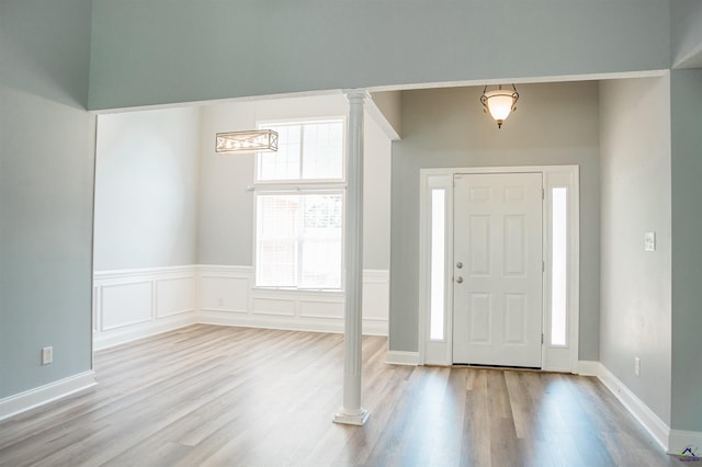121 Spring Chase Cir, Kathleen, GA 31047 - entrance foyer with wood finished floors and ornate columns