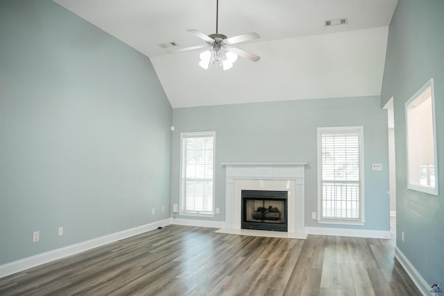 121 Spring Chase Cir, Kathleen, GA 31047 - unfurnished living room with dark wood-style floors, ceiling fan, a fireplace with flush hearth, and high vaulted ceiling