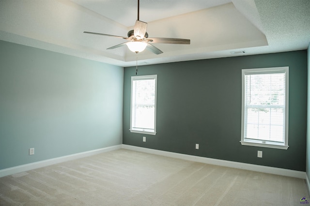 121 Spring Chase Cir, Kathleen, GA 31047 - unfurnished room featuring a raised ceiling, a ceiling fan, and light colored carpet