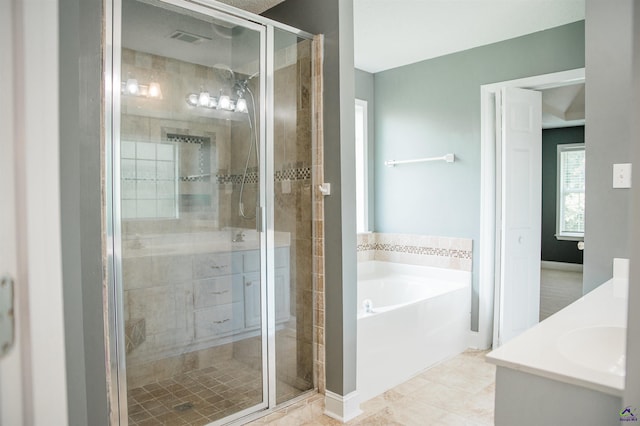 121 Spring Chase Cir, Kathleen, GA 31047 - full bathroom with a garden tub, a stall shower, vanity, and tile patterned floors
