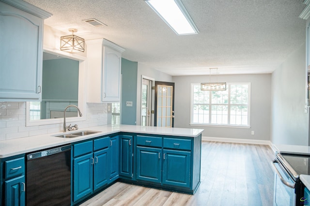 121 Spring Chase Cir, Kathleen, GA 31047 - kitchen featuring black dishwasher, stainless steel electric range, a peninsula, blue cabinets, and a textured ceiling