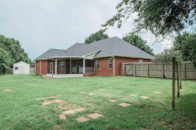 121 Spring Chase Cir, Kathleen, GA 31047 - back of property with brick siding, a sunroom, a storage shed, and a shingled roof