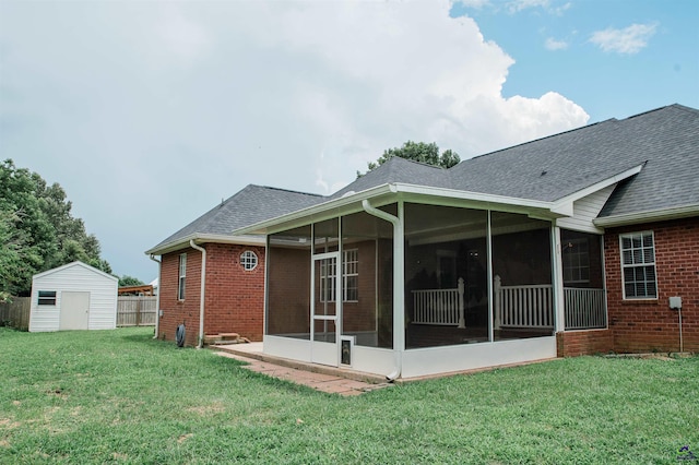 121 Spring Chase Cir, Kathleen, GA 31047 - back of property with brick siding, a sunroom, a shingled roof, and a storage shed