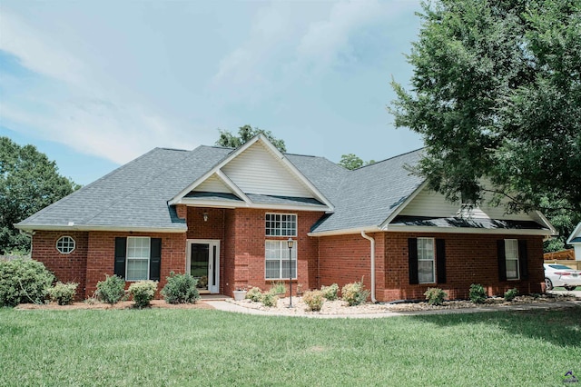 121 Spring Chase Cir, Kathleen, GA 31047 - traditional-style house with brick siding, a front lawn, and a shingled roof