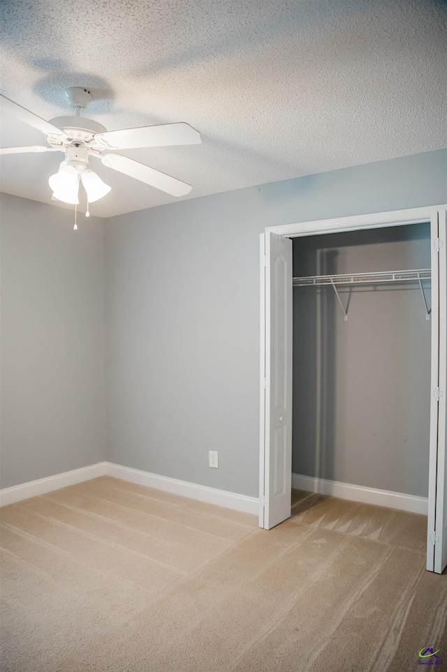 121 Spring Chase Cir, Kathleen, GA 31047 - unfurnished bedroom with light carpet, a closet, and a ceiling fan