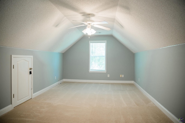 121 Spring Chase Cir, Kathleen, GA 31047 - bonus room with a textured ceiling, light carpet, a ceiling fan, and lofted ceiling