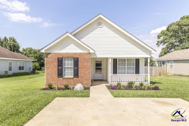 313 Strawbridge Ln, Bonaire, GA 31005 - view of front facade with brick siding and a porch