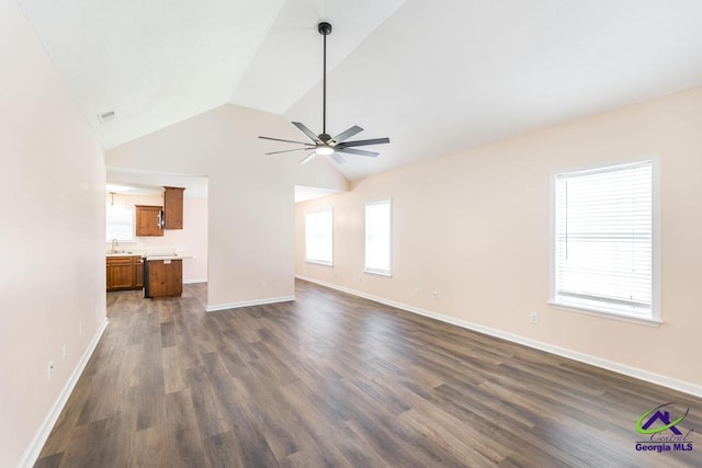 313 Strawbridge Ln, Bonaire, GA 31005 - unfurnished living room with a ceiling fan, dark wood-style flooring, and high vaulted ceiling
