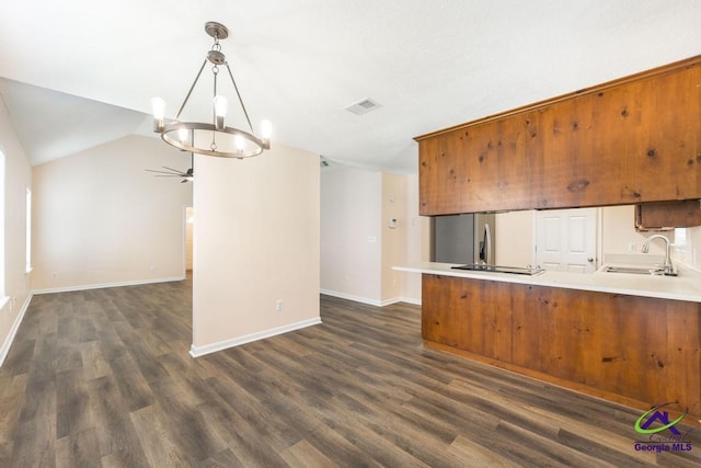 313 Strawbridge Ln, Bonaire, GA 31005 - kitchen with freestanding refrigerator, open floor plan, a ceiling fan, a chandelier, and a peninsula