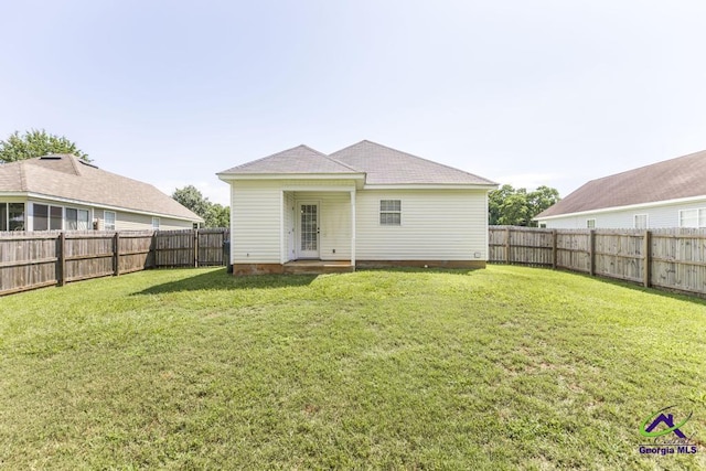 313 Strawbridge Ln, Bonaire, GA 31005 - rear view of house featuring a fenced backyard