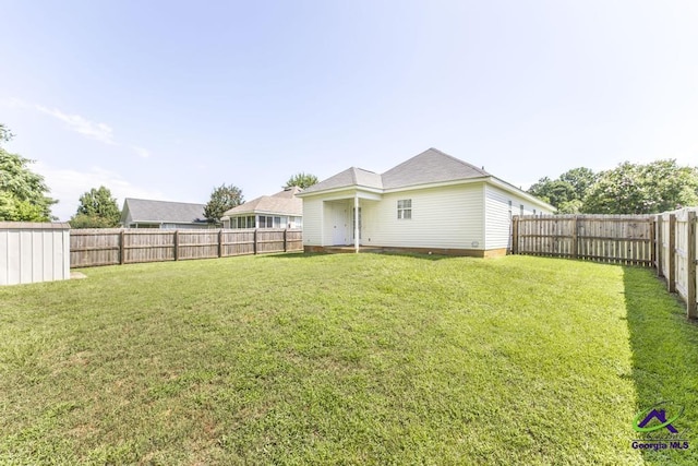 313 Strawbridge Ln, Bonaire, GA 31005 - rear view of property featuring a fenced backyard