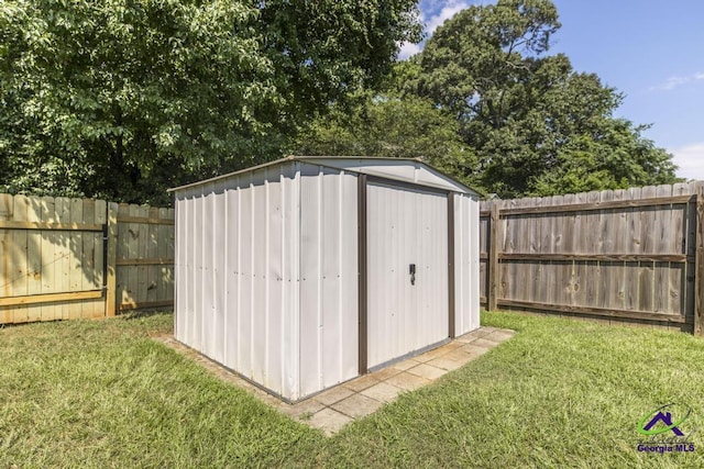 313 Strawbridge Ln, Bonaire, GA 31005 - view of shed with a fenced backyard