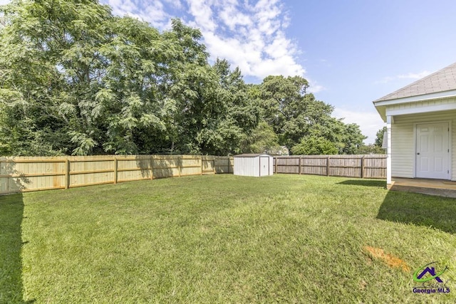 313 Strawbridge Ln, Bonaire, GA 31005 - fenced backyard featuring a storage unit