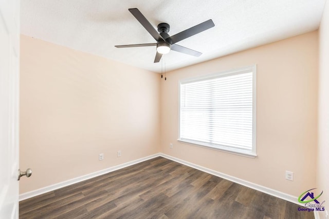 313 Strawbridge Ln, Bonaire, GA 31005 - empty room with ceiling fan and dark wood-type flooring
