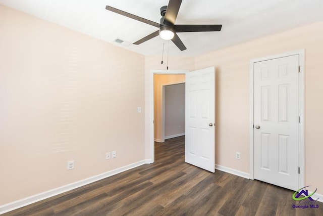 313 Strawbridge Ln, Bonaire, GA 31005 - unfurnished bedroom featuring dark wood-style flooring and a ceiling fan