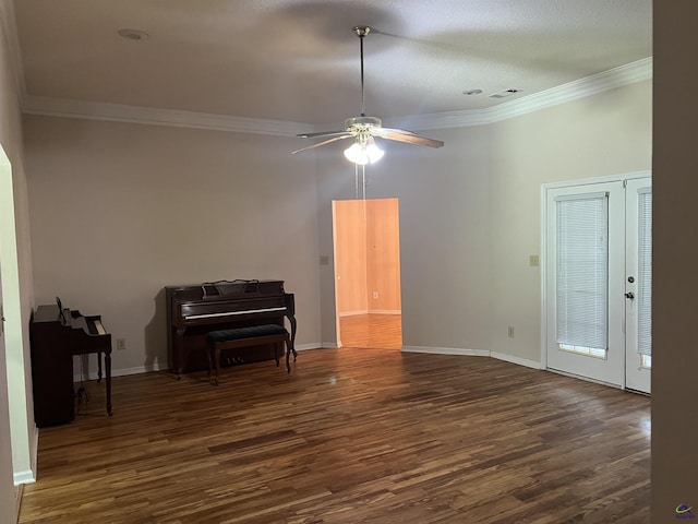 318 Pheasant Rdg, Warner Robins, GA 31088 - unfurnished living room featuring dark wood-style floors, ornamental molding, a ceiling fan, and french doors