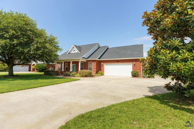 112 Finegand Pl, Warner Robins, GA 31088 - view of front of property with driveway, a front yard, an attached garage, and brick siding