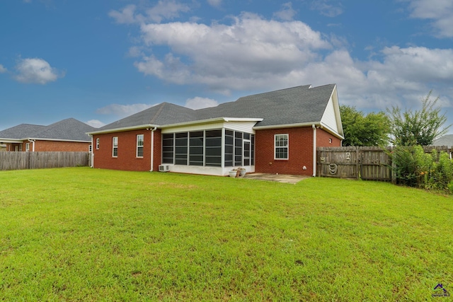 112 Finegand Pl, Warner Robins, GA 31088 - back of property featuring a sunroom, brick siding, a fenced backyard, and a patio area