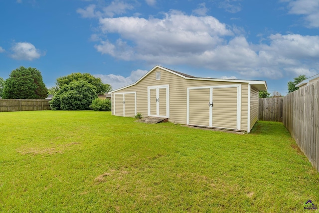 112 Finegand Pl, Warner Robins, GA 31088 - back of house with a fenced backyard and an outdoor structure