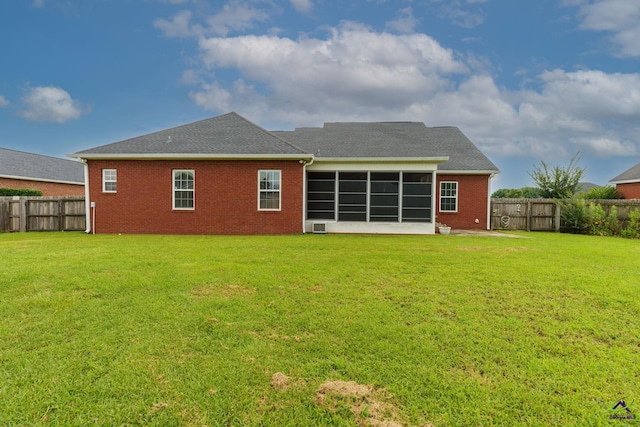 112 Finegand Pl, Warner Robins, GA 31088 - back of property featuring a fenced backyard, a sunroom, brick siding, and a shingled roof