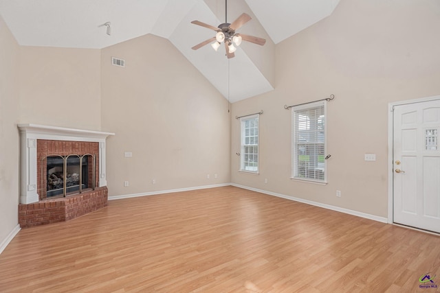 112 Finegand Pl, Warner Robins, GA 31088 - unfurnished living room with a ceiling fan, light wood-style flooring, high vaulted ceiling, and a fireplace