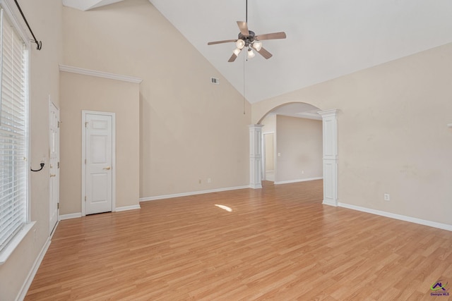 112 Finegand Pl, Warner Robins, GA 31088 - unfurnished room featuring high vaulted ceiling, decorative columns, ceiling fan, arched walkways, and light wood finished floors