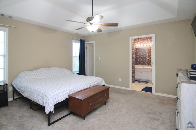 306 Bryson Way, Warner Robins, GA 31088 - bedroom with multiple windows, light colored carpet, ceiling fan, and ensuite bath