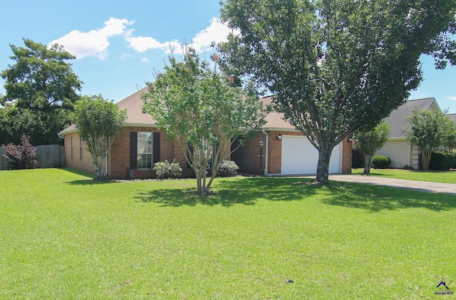 306 Bryson Way, Warner Robins, GA 31088 - view of property hidden behind natural elements featuring concrete driveway, brick siding, and a garage