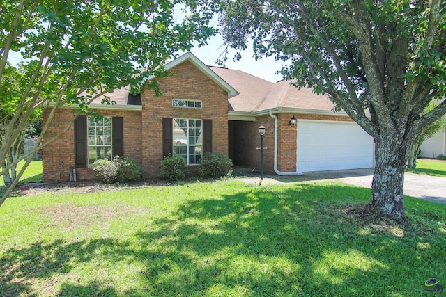 306 Bryson Way, Warner Robins, GA 31088 - view of front of house with an attached garage, a front yard, and brick siding
