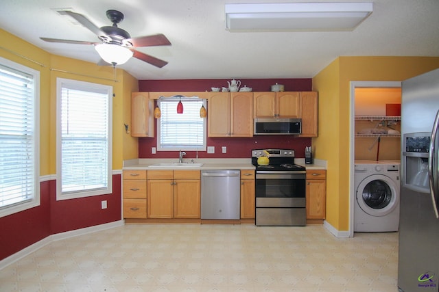 306 Bryson Way, Warner Robins, GA 31088 - kitchen with stainless steel appliances, washer / dryer, light countertops, a ceiling fan, and light flooring
