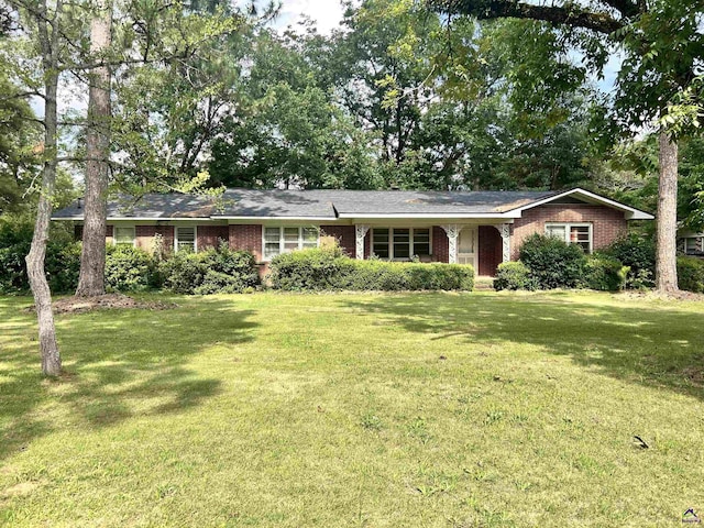 1406 Knoxville St, Fort Valley, GA 31030 - ranch-style home featuring brick siding and a front yard