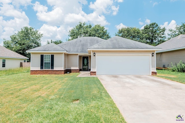 330 Hidden Creek Cir, Warner Robins, GA 31088 - ranch-style home with concrete driveway, an attached garage, a front lawn, and a shingled roof